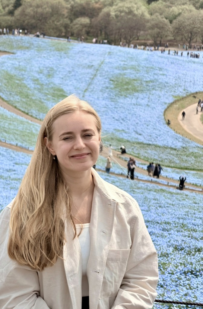 Weronika Malcher in a field of blue flowers